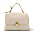Simple solid color handbag with a slouchy shoulder strap